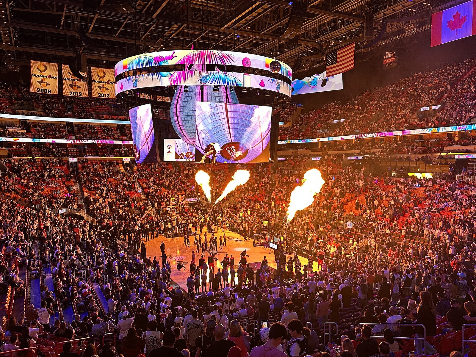 Kaseya Center packed before a Miami Heat game, with championship banners hanging from the rafters