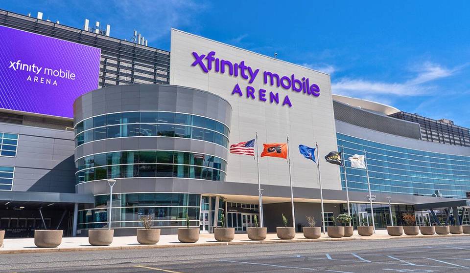 Xfinity Mobile Arena in Philadelphia on a bright day, where the 76ers open preseason and await Ariel Hukporti’s MRI results