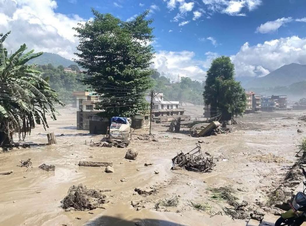 Streets of a Nepali town buried in mud and debris after the August 2026 floods