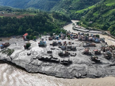 Aerial view of a village in Nepal buried under flood debris