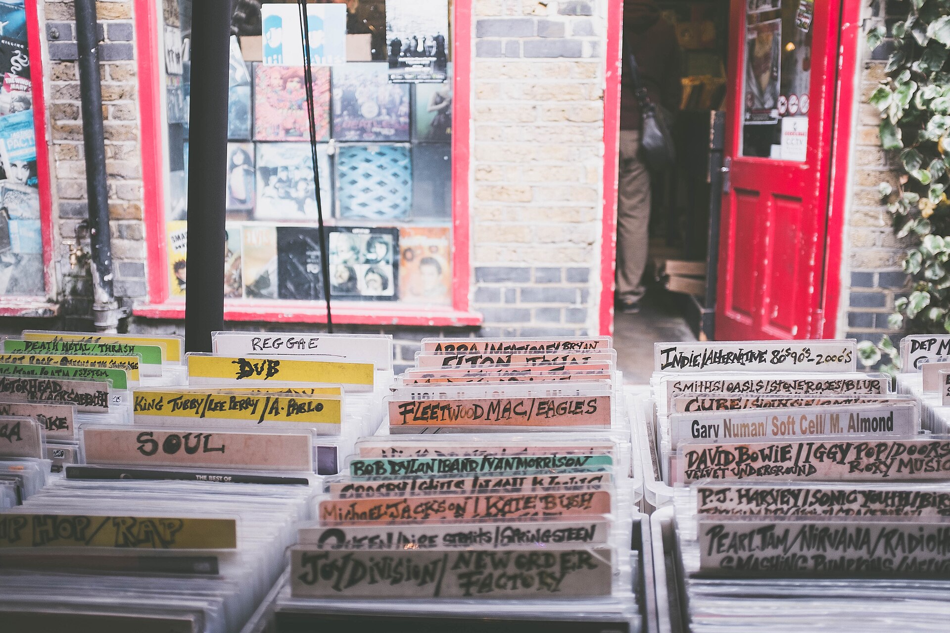 A wall of colorful vinyl records on display
