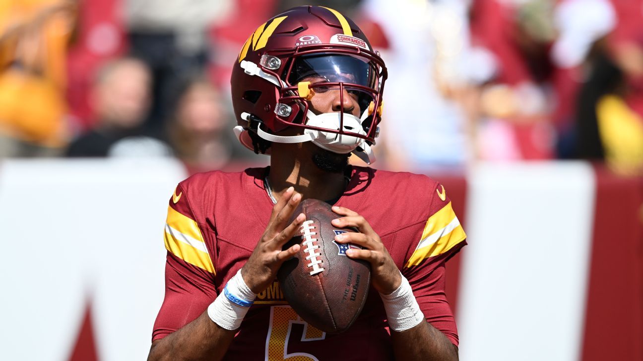 Washington Commanders quarterback Jayden Daniels (5) in the burgundy home uniform — one of the NFL quarterbacks lost to the 2026 season's injury crisis.