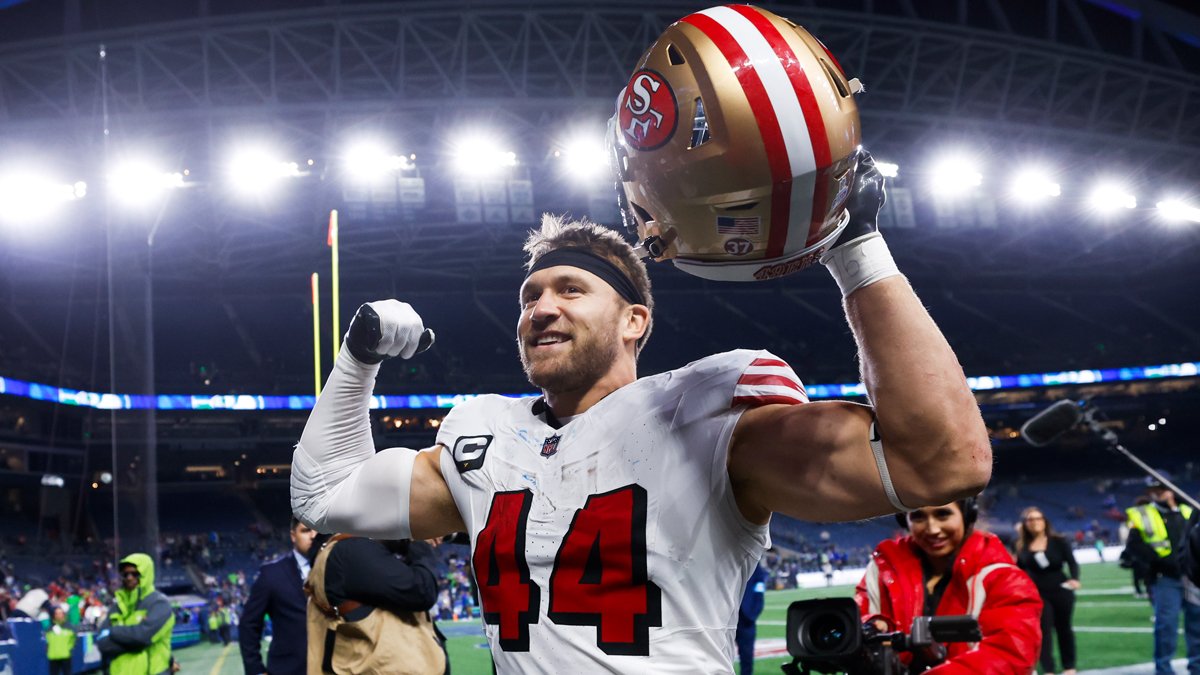 San Francisco 49ers fullback Kyle Juszczyk celebrating with his helmet raised