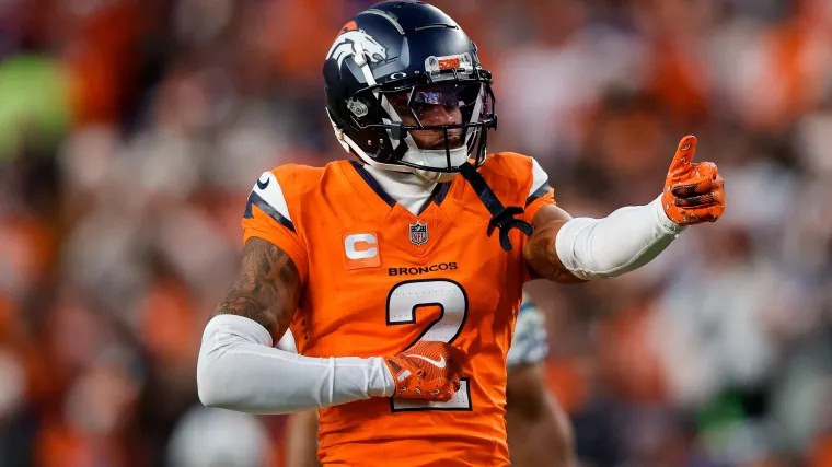 Denver Broncos cornerback Pat Surtain II (2) in the orange home uniform — the All-Pro is expected to land on injured reserve with an ankle injury.