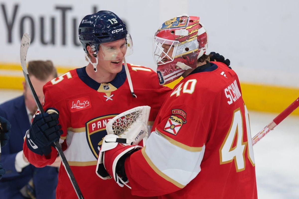 Florida Panthers center Anton Lundell celebrates with goaltender Akira Schmid after the game against the Winnipeg Jets at Amerant Bank Arena on October 30, 2026