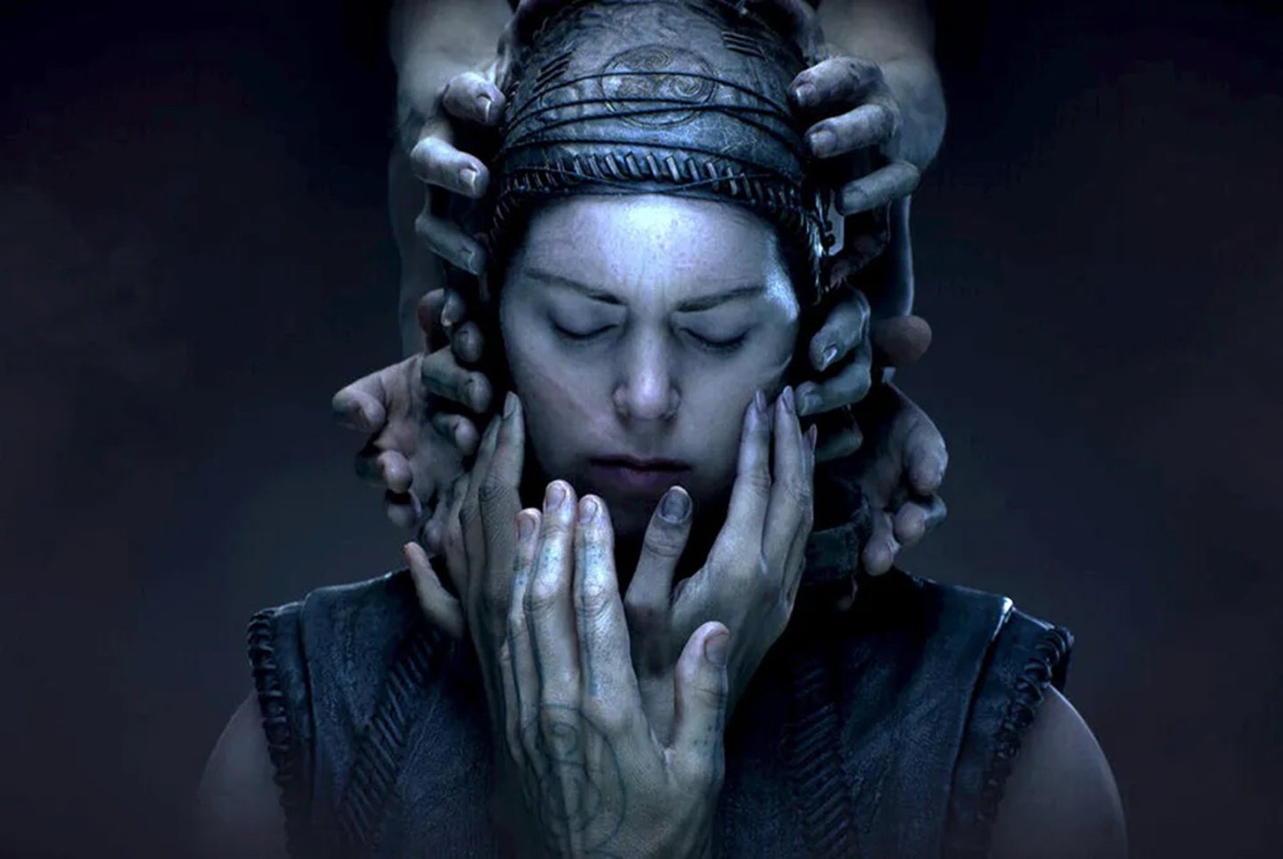 Senua in official Hellblade II key art, hands pressed around her head