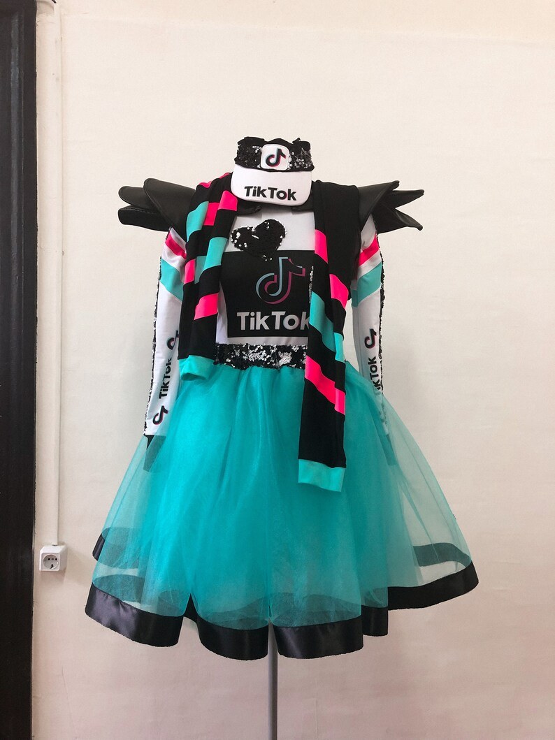 A DIY costume dressed as the TikTok app, with the logo and brand colors