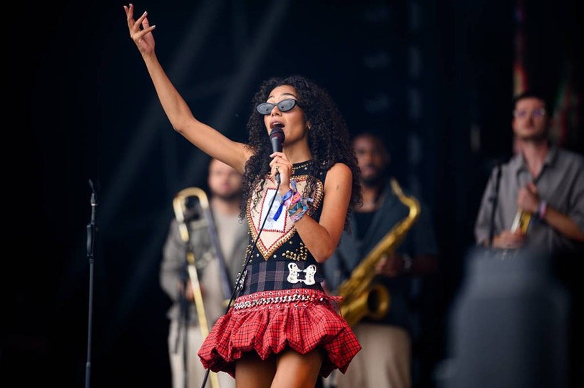 Olivia Dean performing live with her band