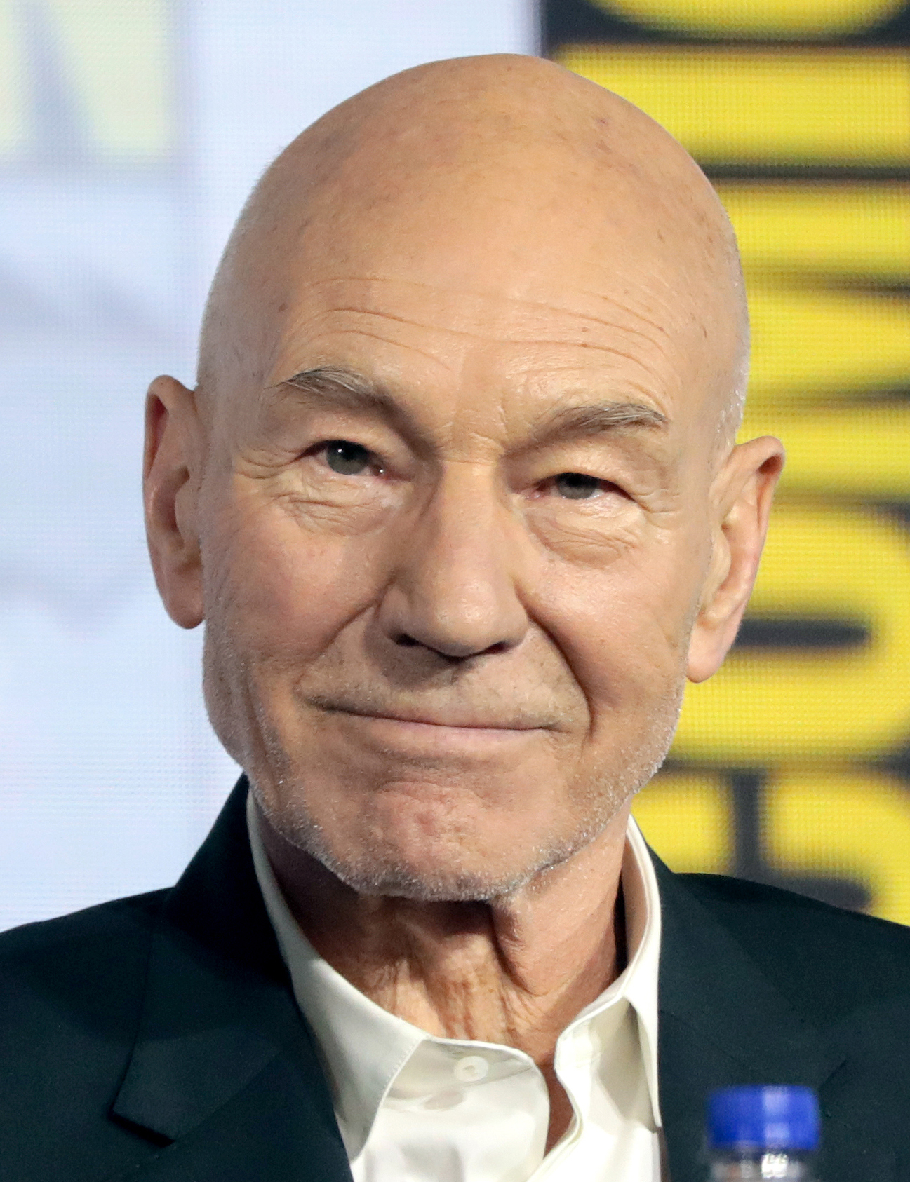 Patrick Stewart at San Diego Comic-Con on July 20, 2019 — a close portrait, smiling gently at the audience