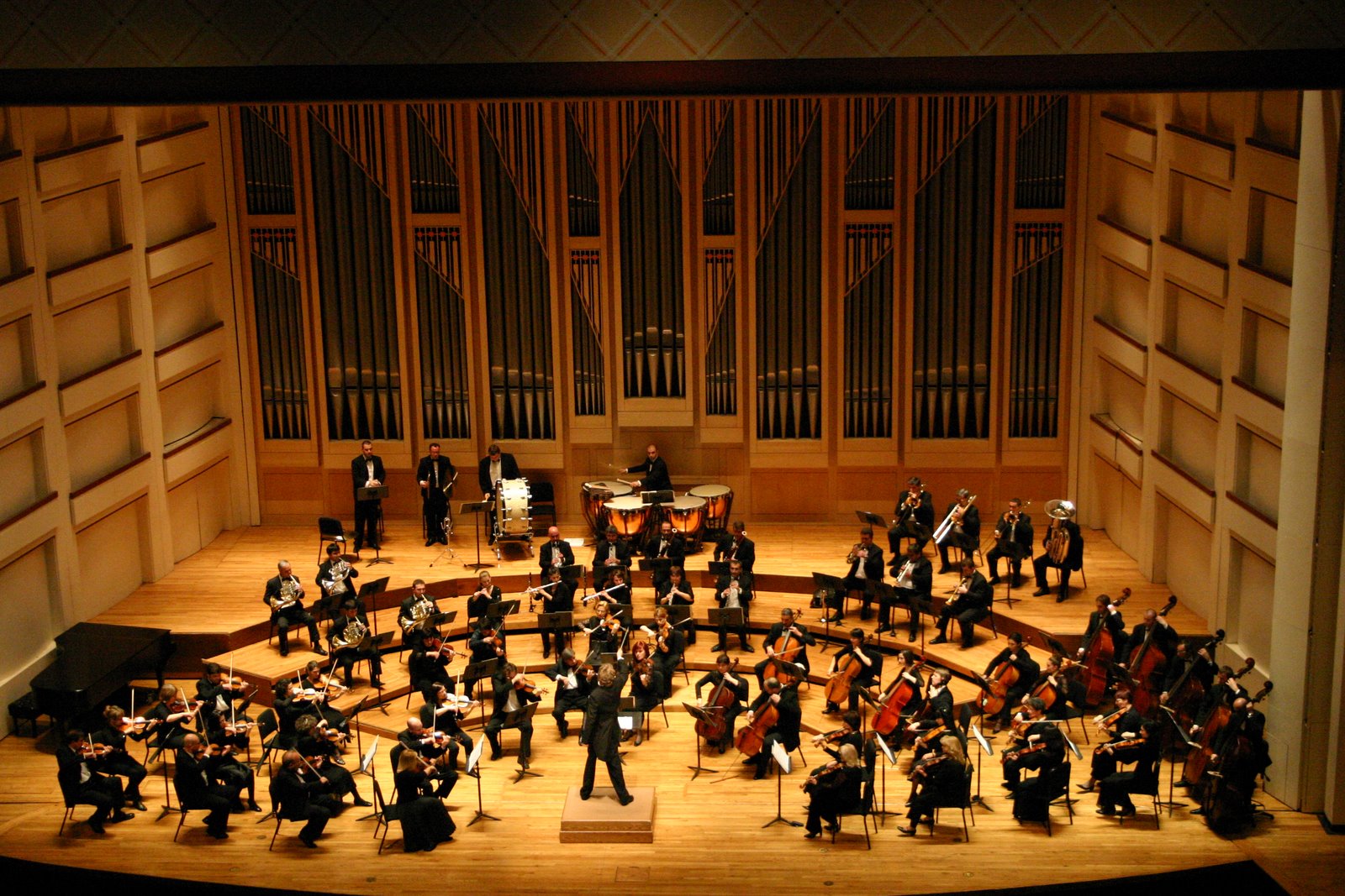 An orchestra performing on stage