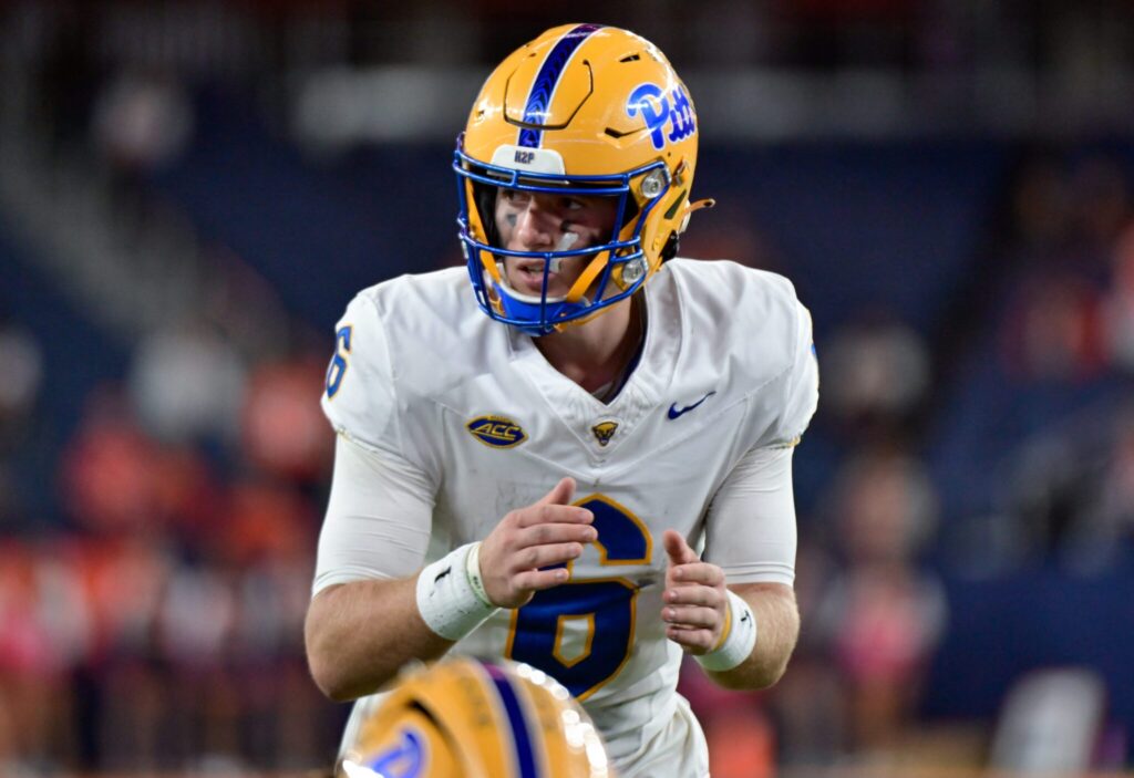 Mason Heintschel in Pitt's white road uniform at Syracuse, ACC patch on the jersey
