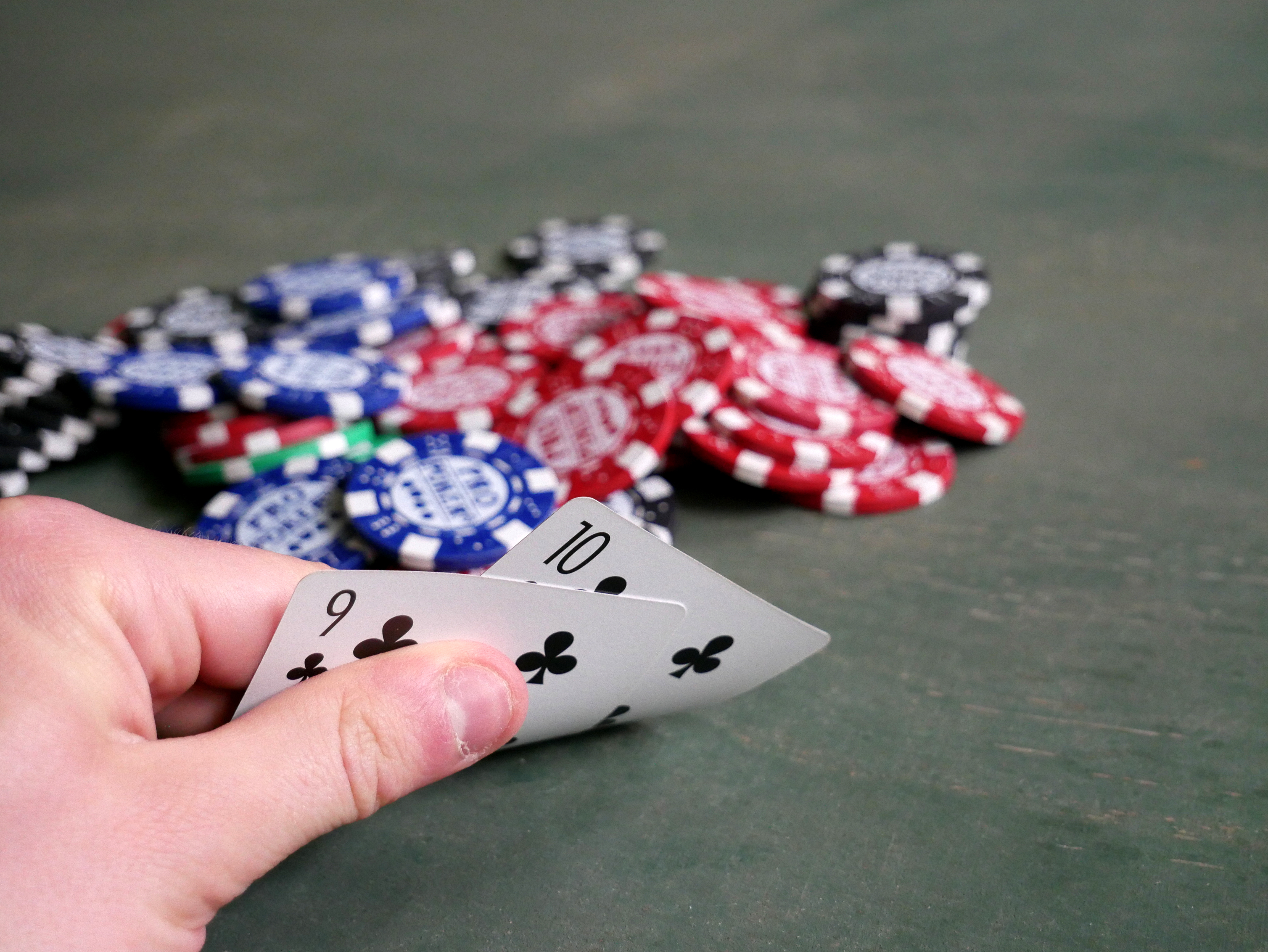 Two poker cards and a stack of poker chips on the felt (file photo)