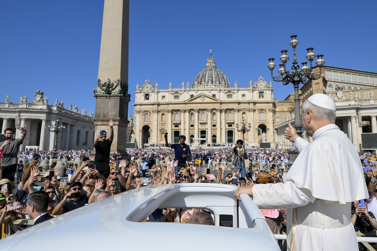 Pope Leo waves to a crowd