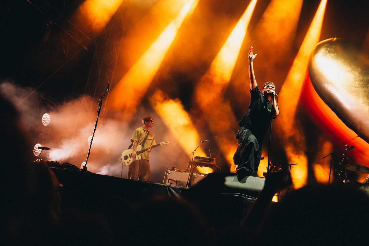 Fontaines D.C. performing live under golden stage lights at Pohoda Festival 2025