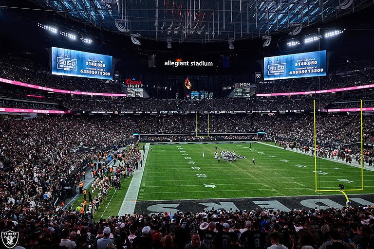 Allegiant Stadium lit up for a Raiders night game
