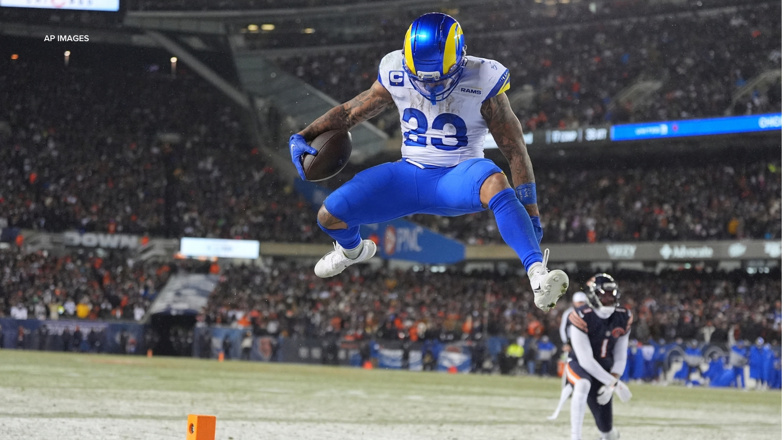 Rams running back Kyren Williams (23) leaps toward the end zone.
