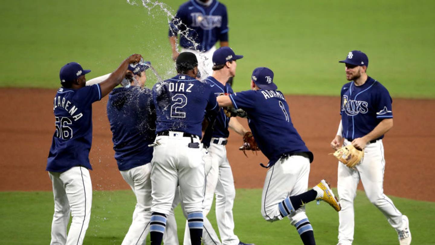Tampa Bay Rays players celebrate — Wednesday’s win sent them to the ALCS