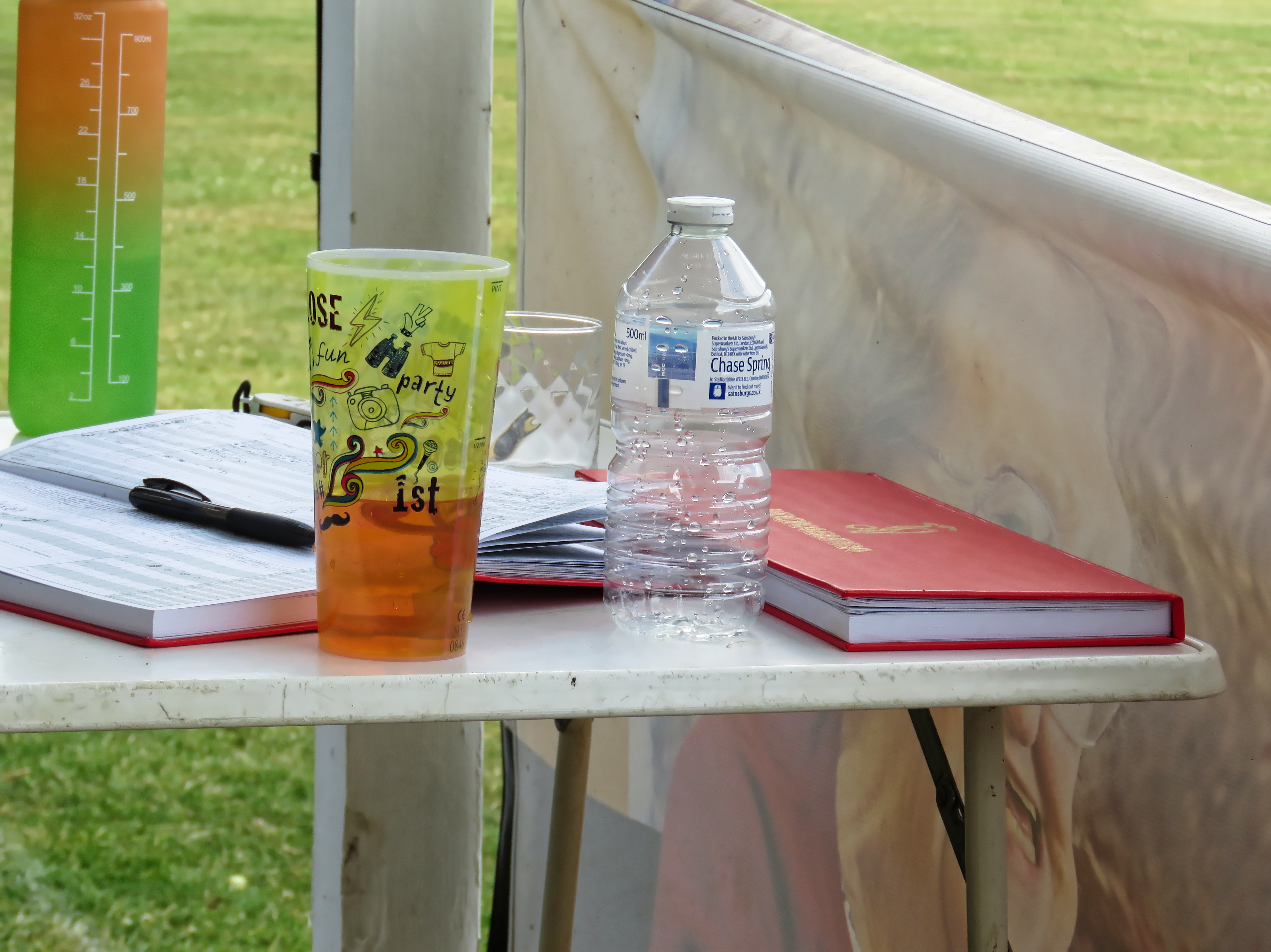 A cricket scorer's open scorebook and pen on the scorer's table at Eastons Cricket Club in Essex, England — file photo