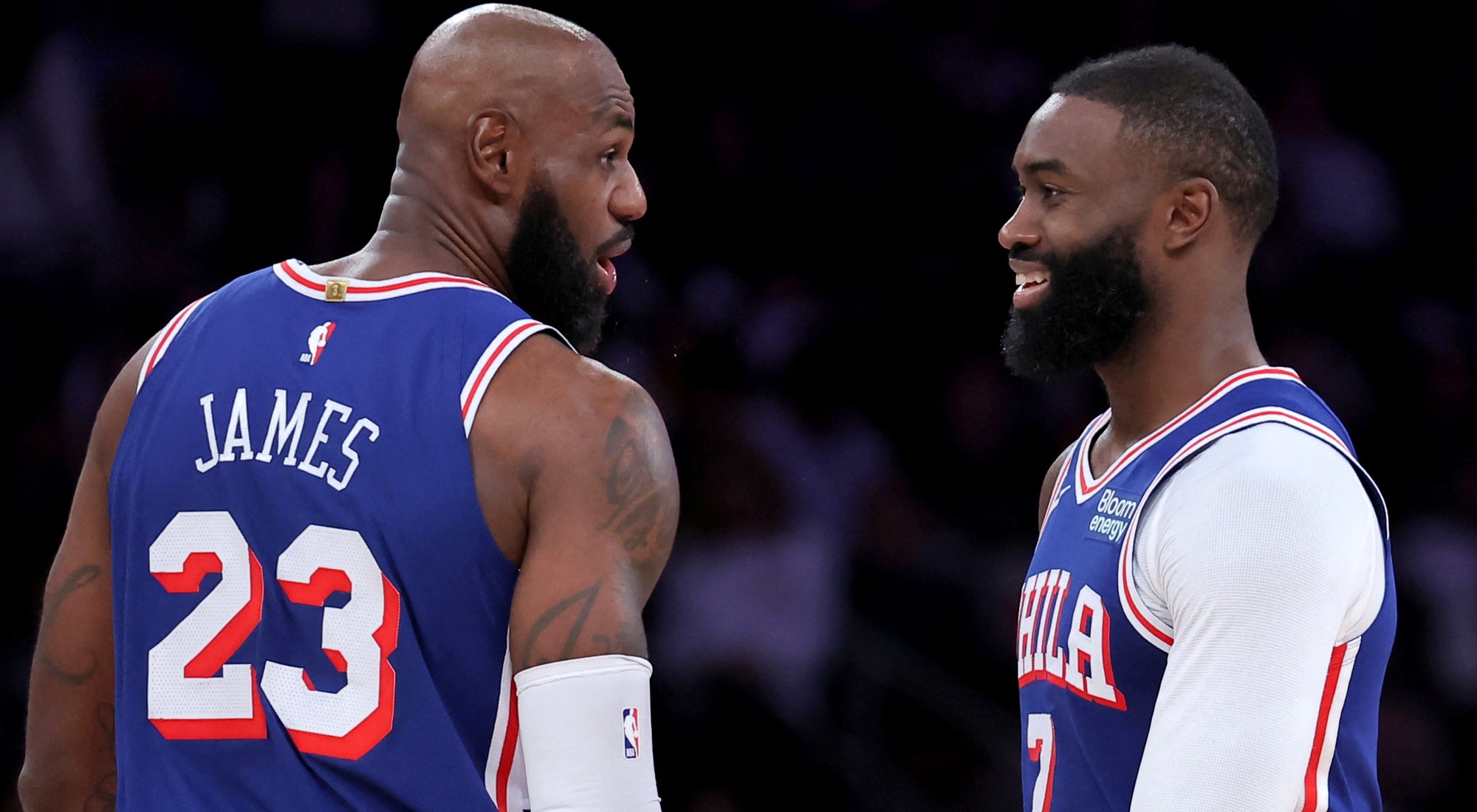 LeBron James, in his Philadelphia 76ers debut, talks with Jaylen Brown during the 76ers’ game against the New York Knicks at Madison Square Garden