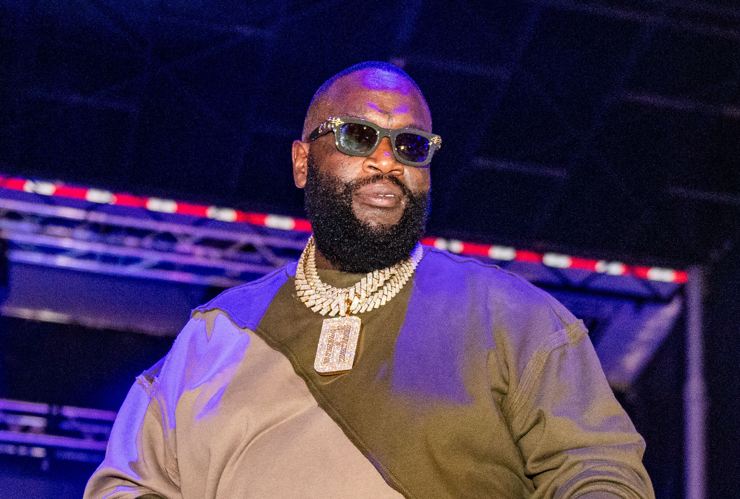 Rick Ross performing onstage during a concert, Detroit, September 2024.