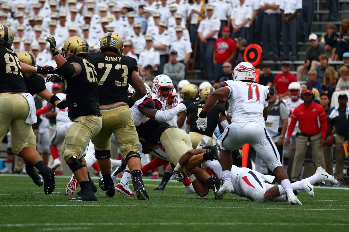 Liberty Flames defenders in action during a game