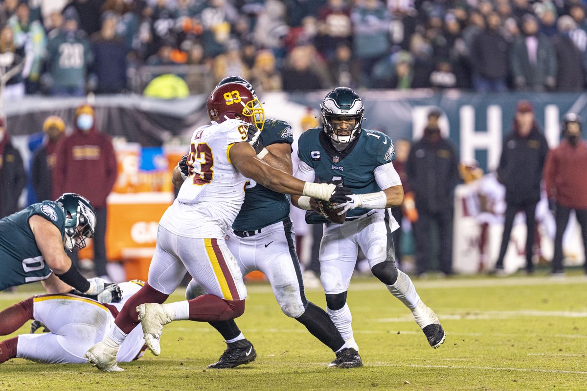 Jalen Hurts of the Philadelphia Eagles carrying the ball during a game against Washington at Lincoln Financial Field