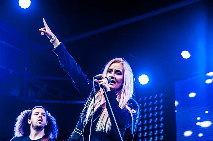 Sass Jordan performing on stage, arm raised, in concert (2017)