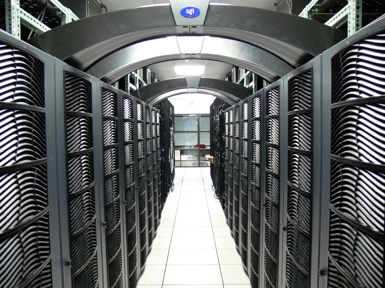 Rows of server racks inside a data center.