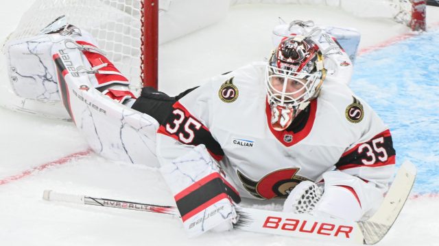 Linus Ullmark makes a save for the Ottawa Senators in Boston — he stopped all 10 shots he faced before leaving the game after the second period.