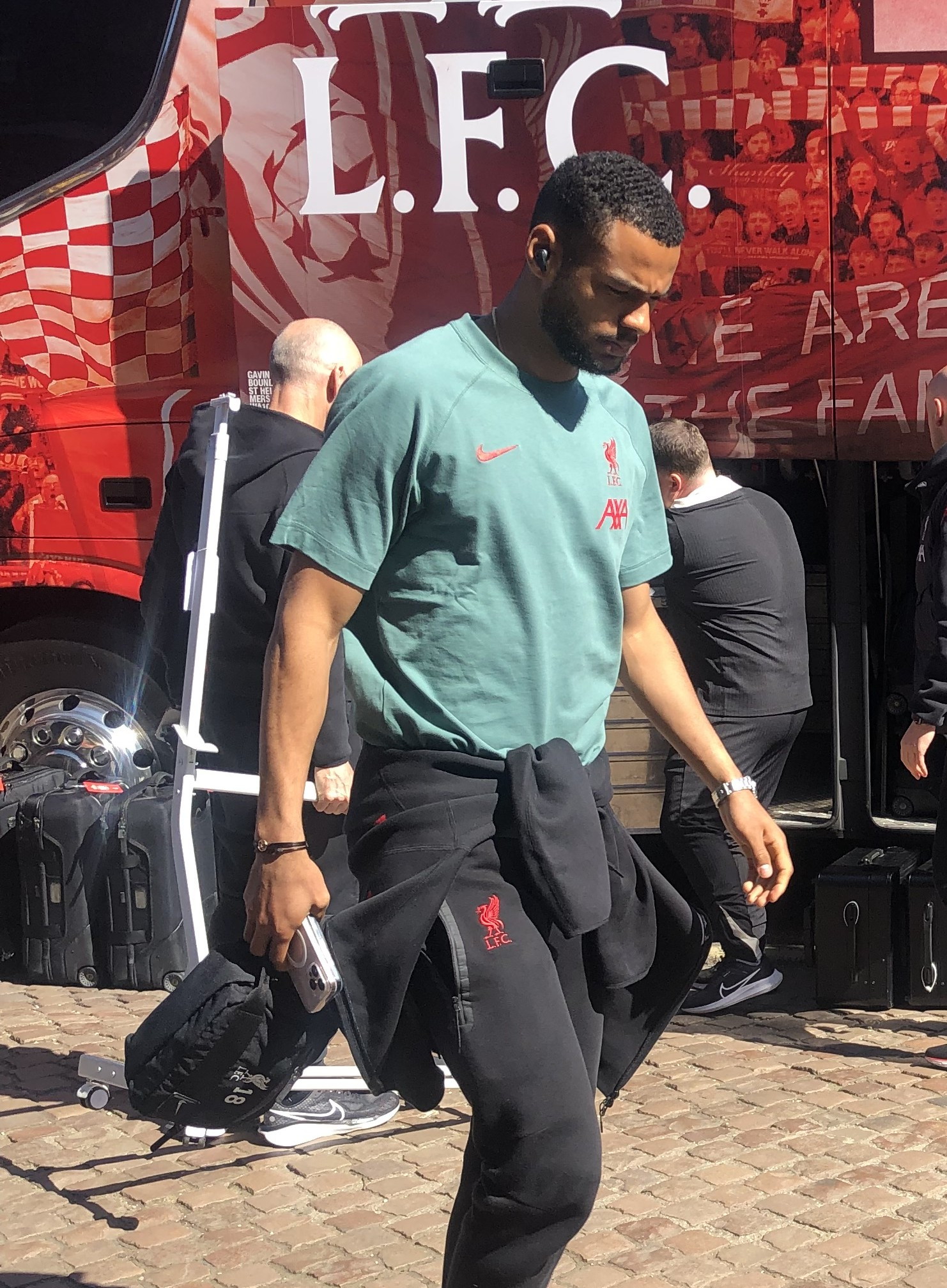 Cody Gakpo arriving at Craven Cottage with Liverpool, in front of the club's team bus, April 2025
