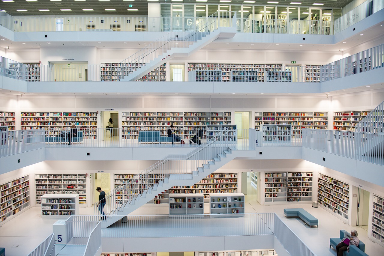 A quiet library reading room with tall bookshelves