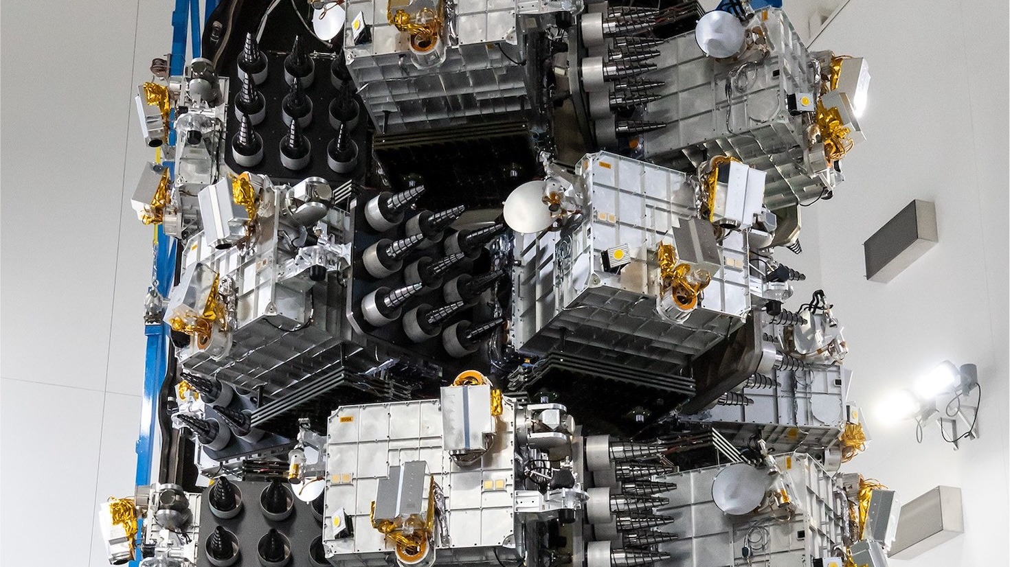Satellites stacked in launch configuration during payload integration