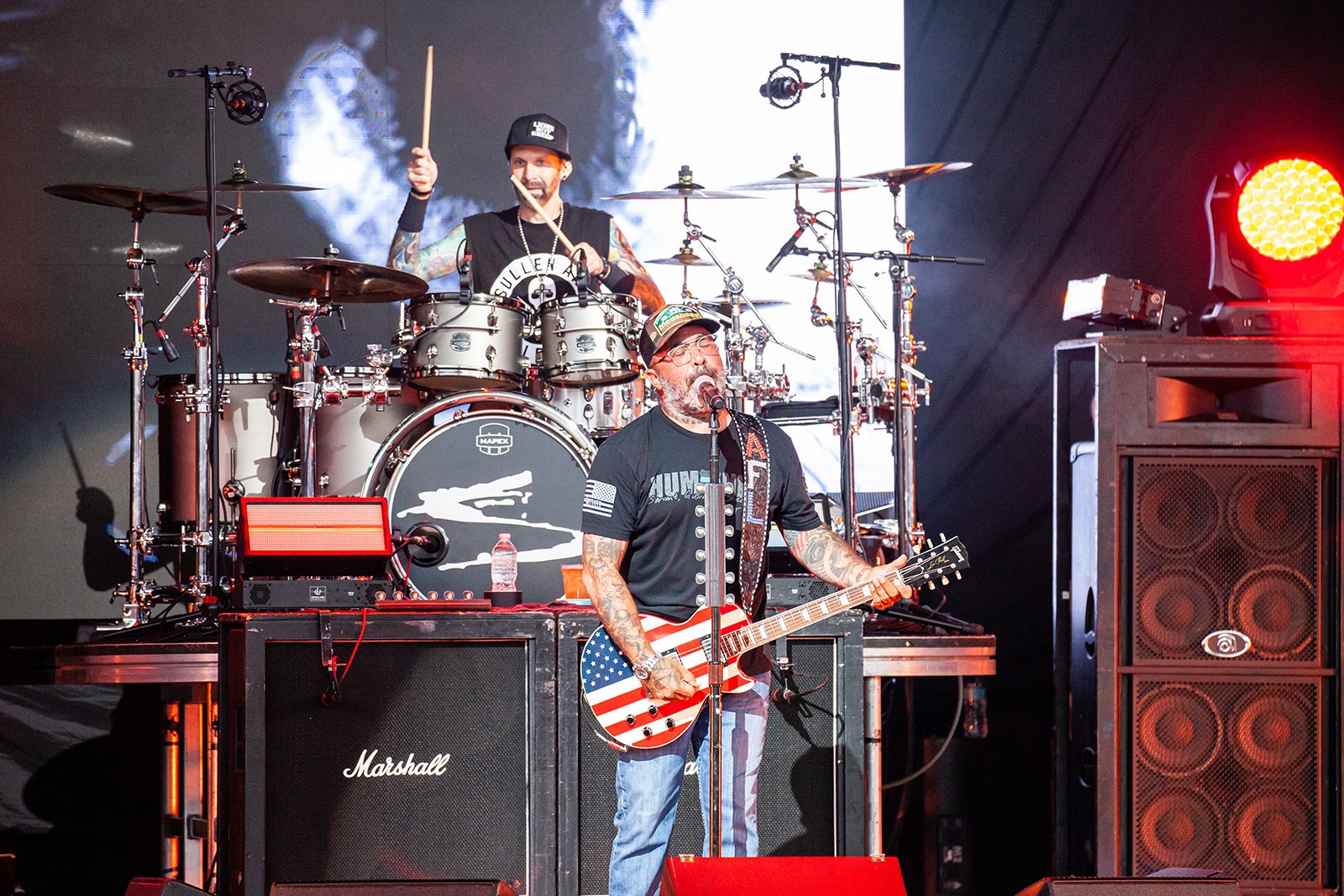 Staind's Aaron Lewis performs live with his American-flag guitar