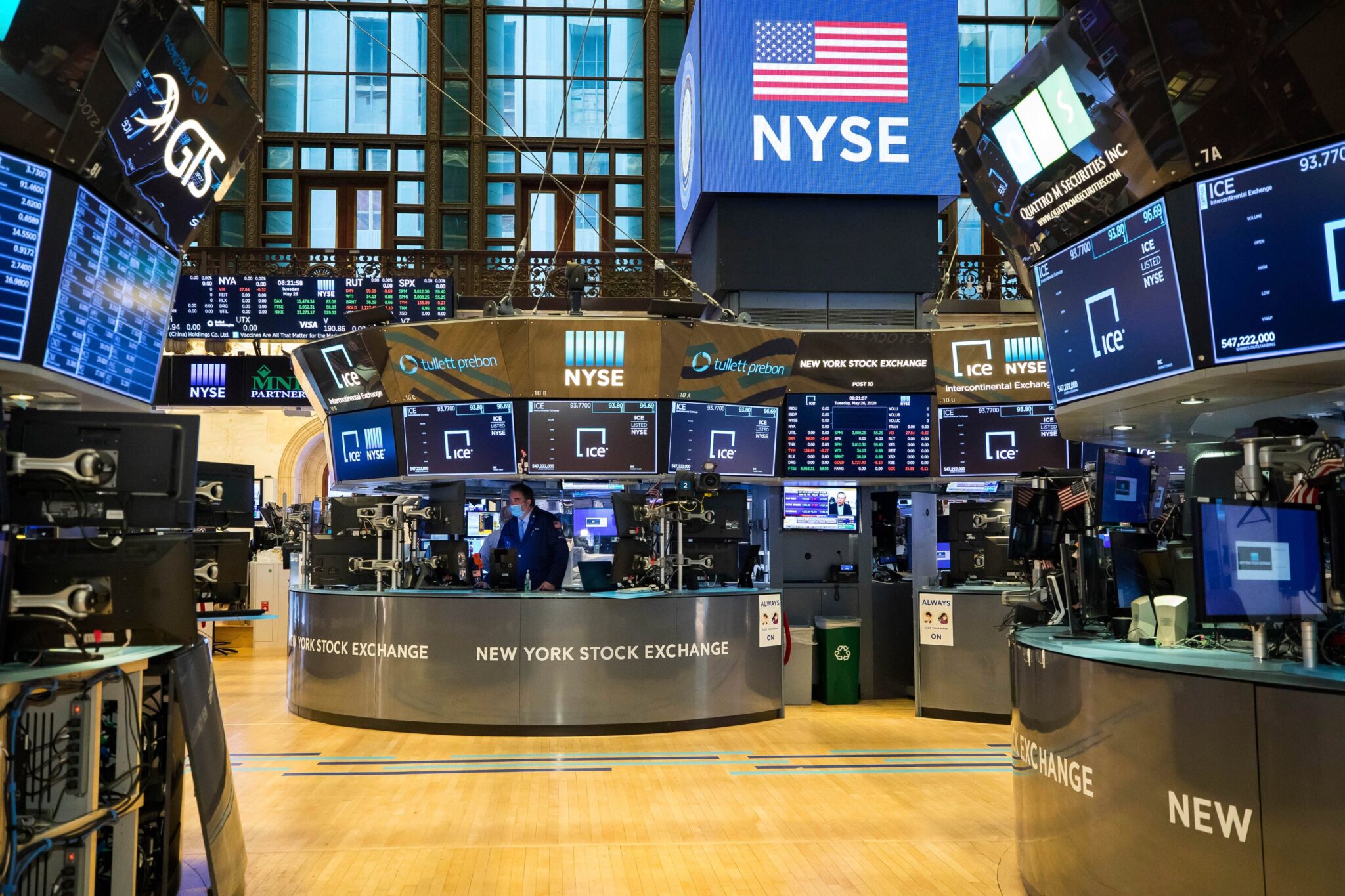 Trading terminals and NYSE-branded displays on the New York Stock Exchange trading floor as the S&P 500 and Nasdaq hit record highs