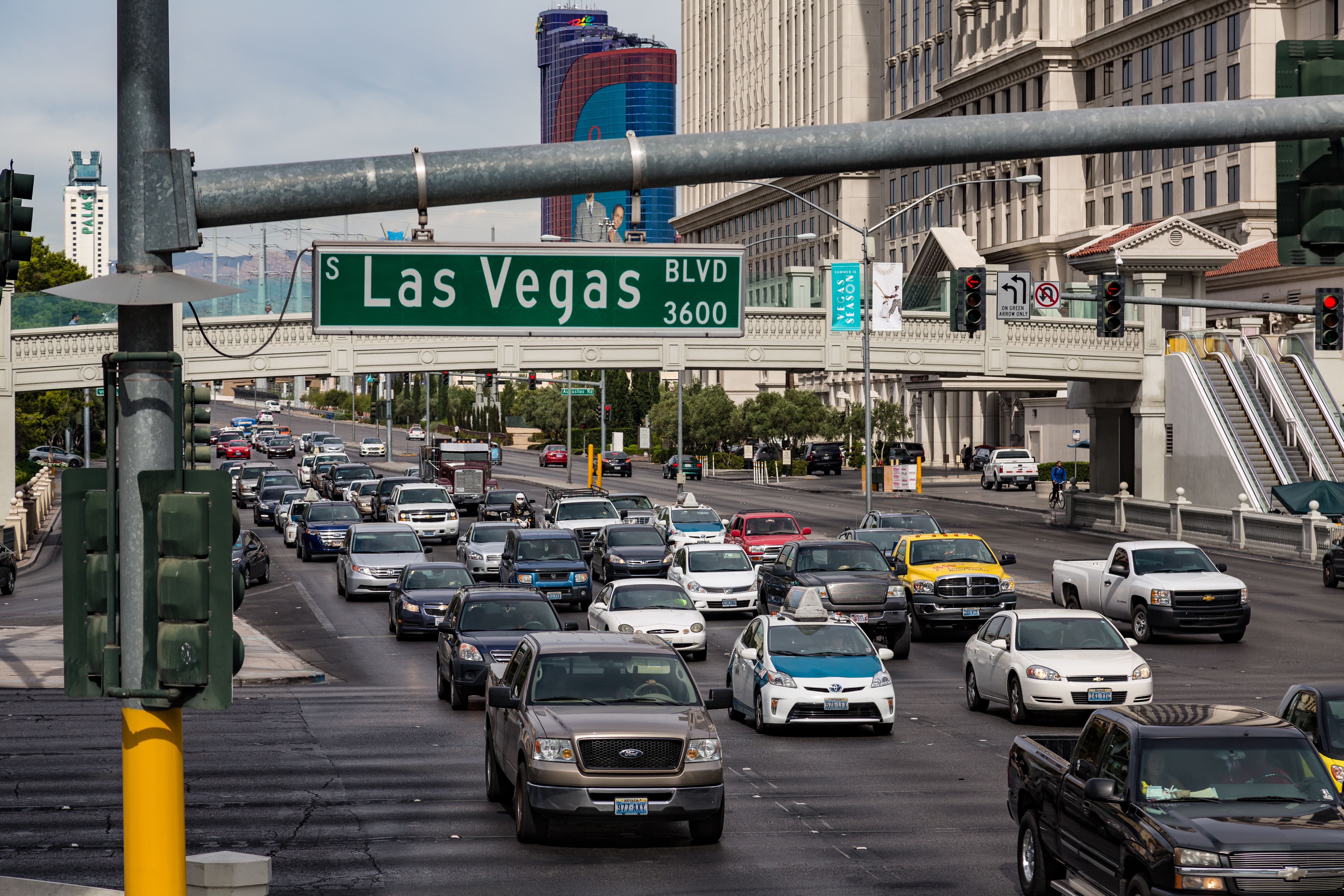 Pedestrian bridges and foot traffic at Las Vegas Boulevard and Flamingo Road in daytime