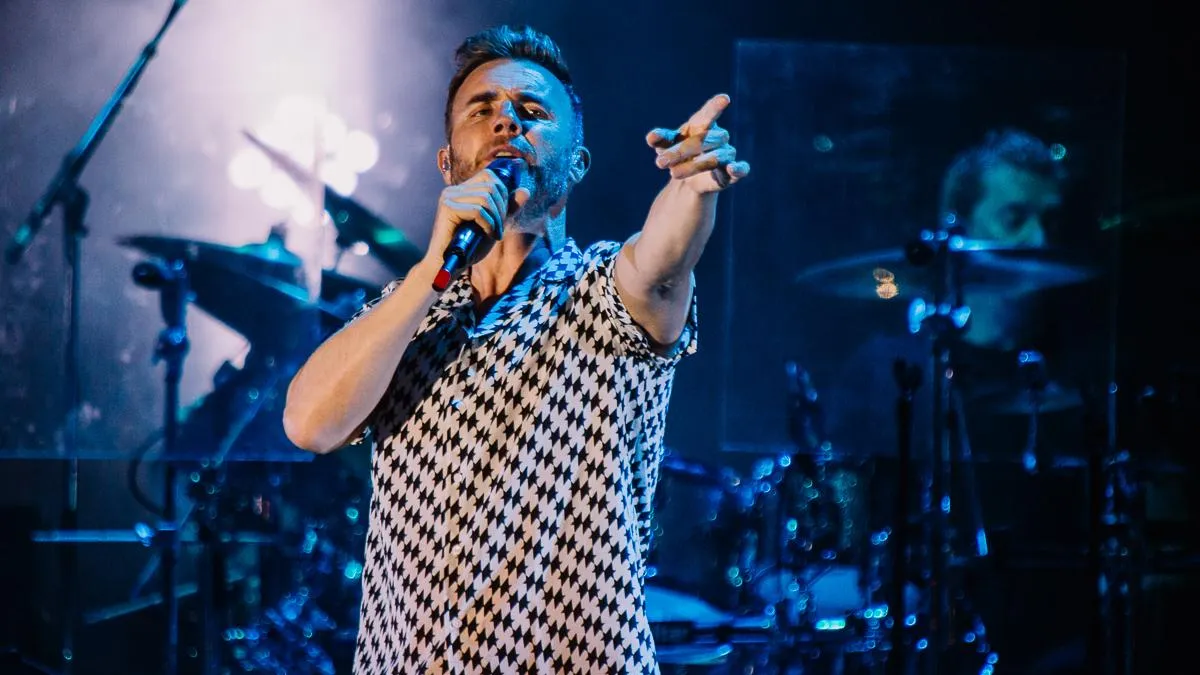 Take That performing live on stage.