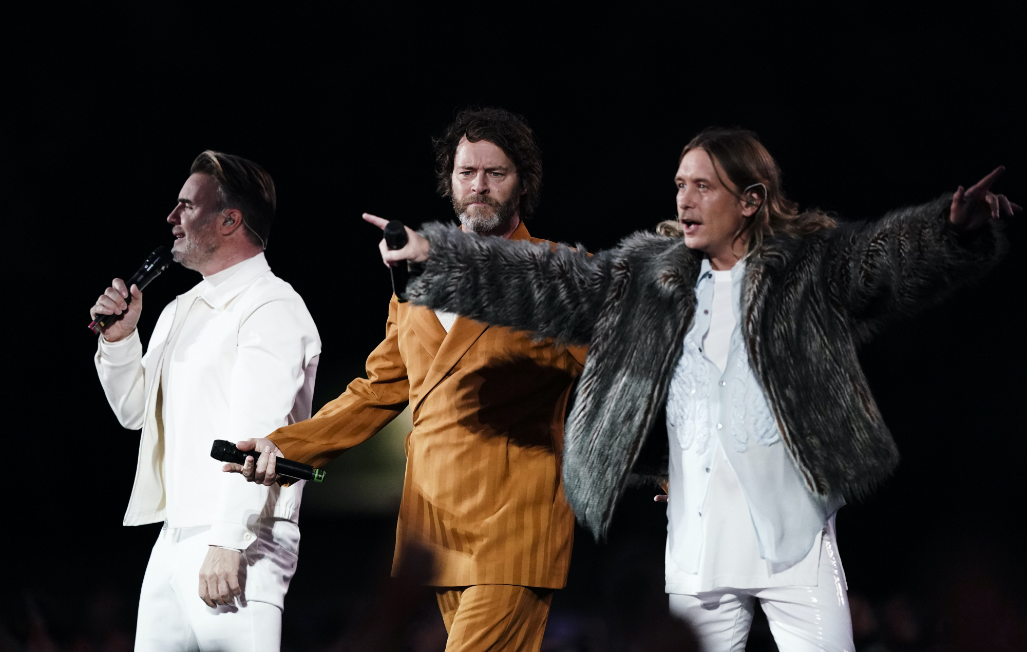 Take That on stage during a 2023 tour announcement.