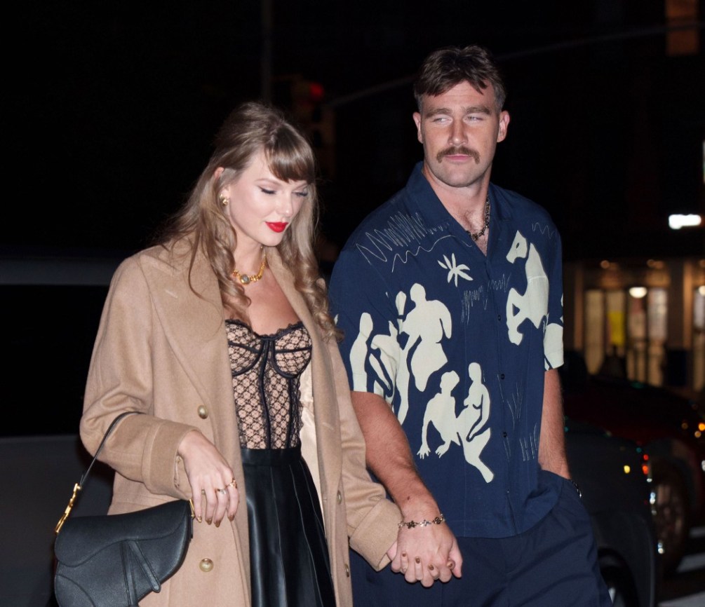 Taylor Swift and Travis Kelce holding hands during a night out in New York City