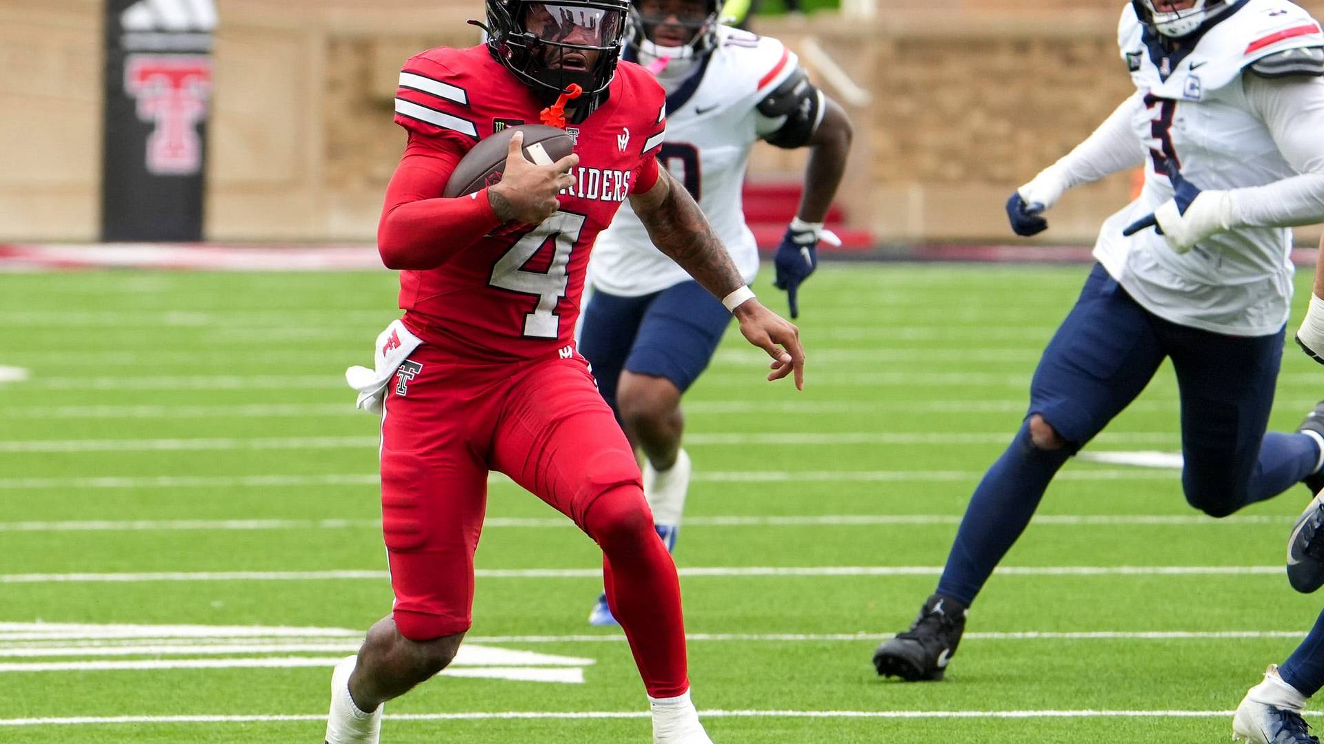 Texas Tech quarterback Thomas Castellanos runs with the ball against Arizona at Galaxy Stadium — in his first start of the season he accounted for three touchdowns in the Red Raiders' 34–26 win
