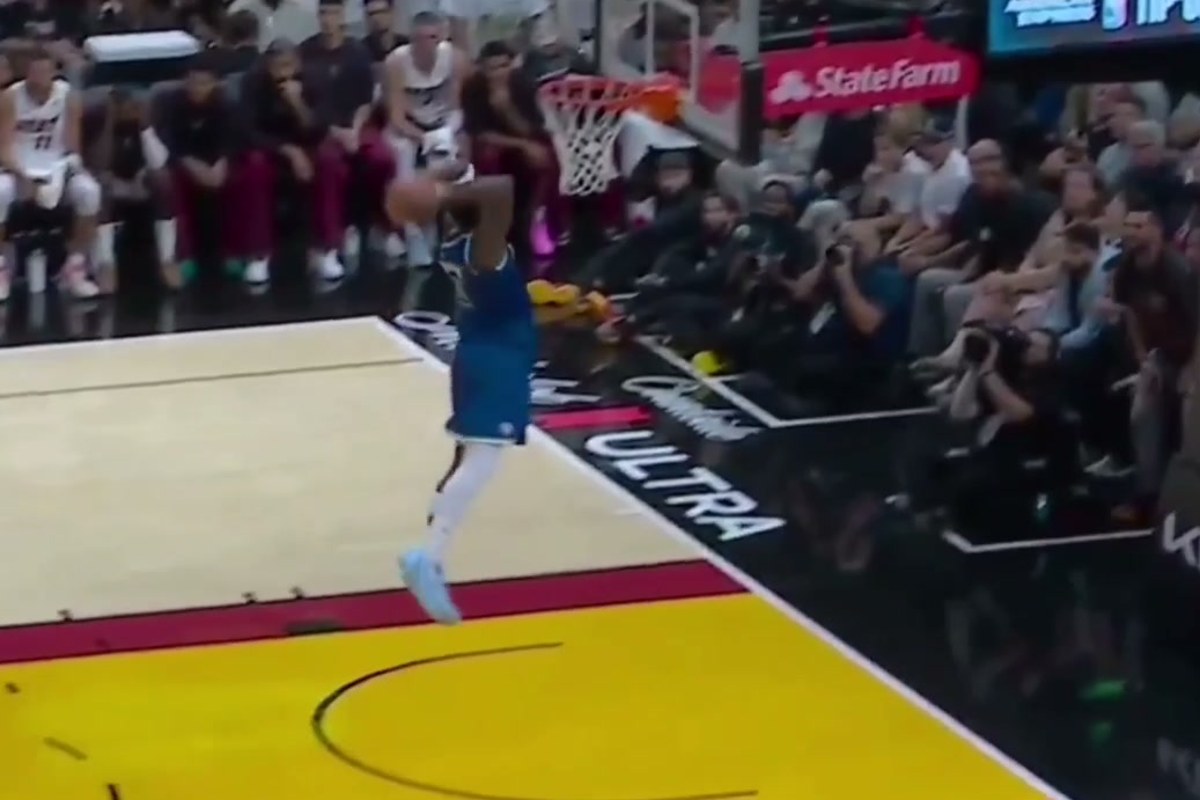 Anthony Edwards finishes at the rim in Miami during his 45-point season opener