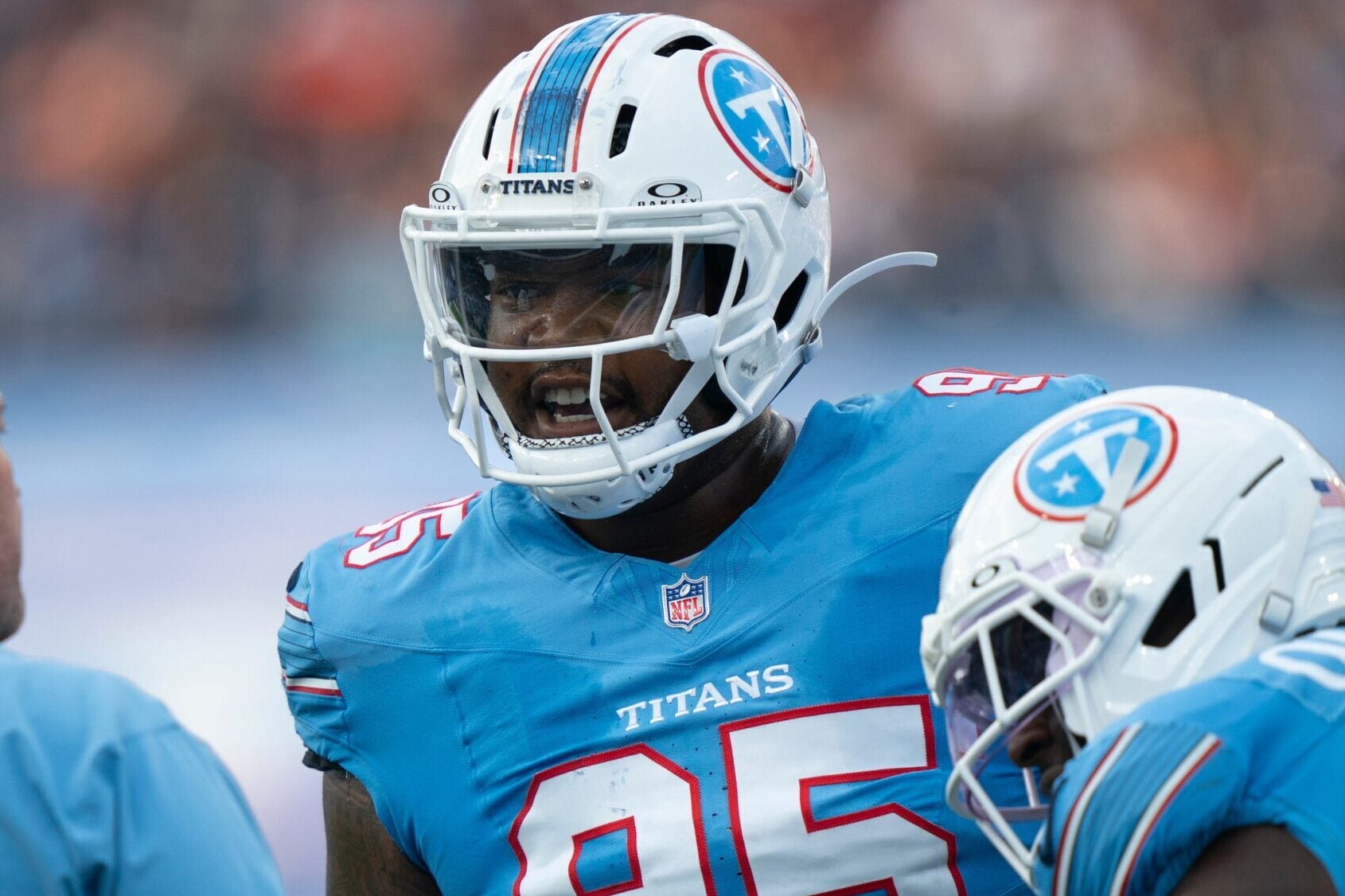 Tennessee Titans defensive tackle Jordan Elliott (95) talks with defensive line coach Aaron Whitecotton during a preseason game at Nissan Stadium on Aug. 29, 2026