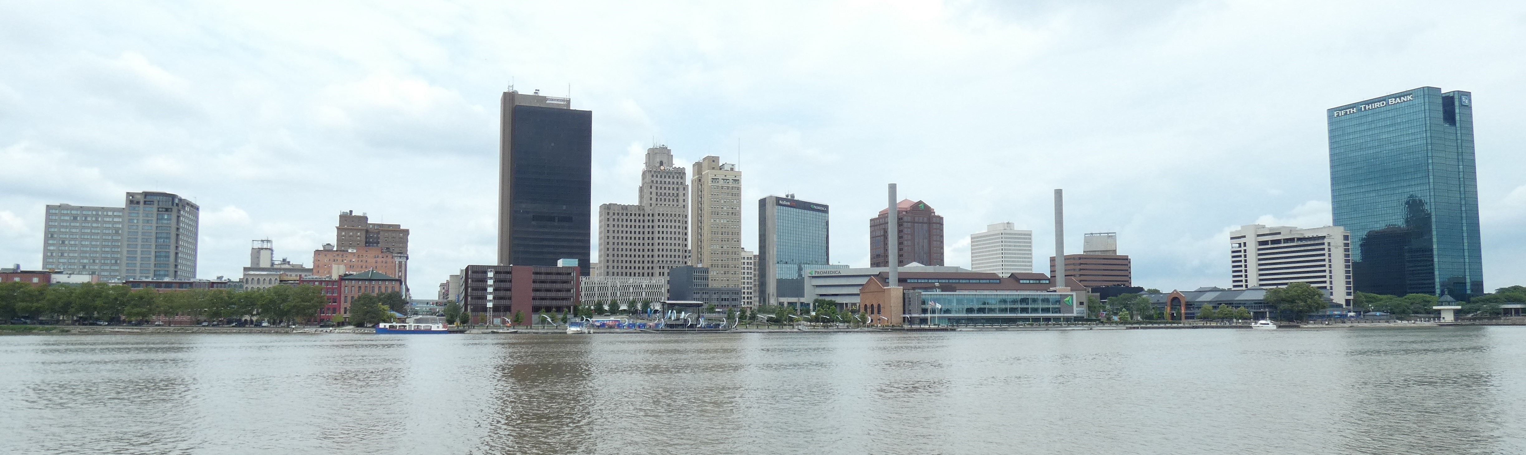 Downtown Toledo, Ohio skyline along the Maumee River in bright daylight