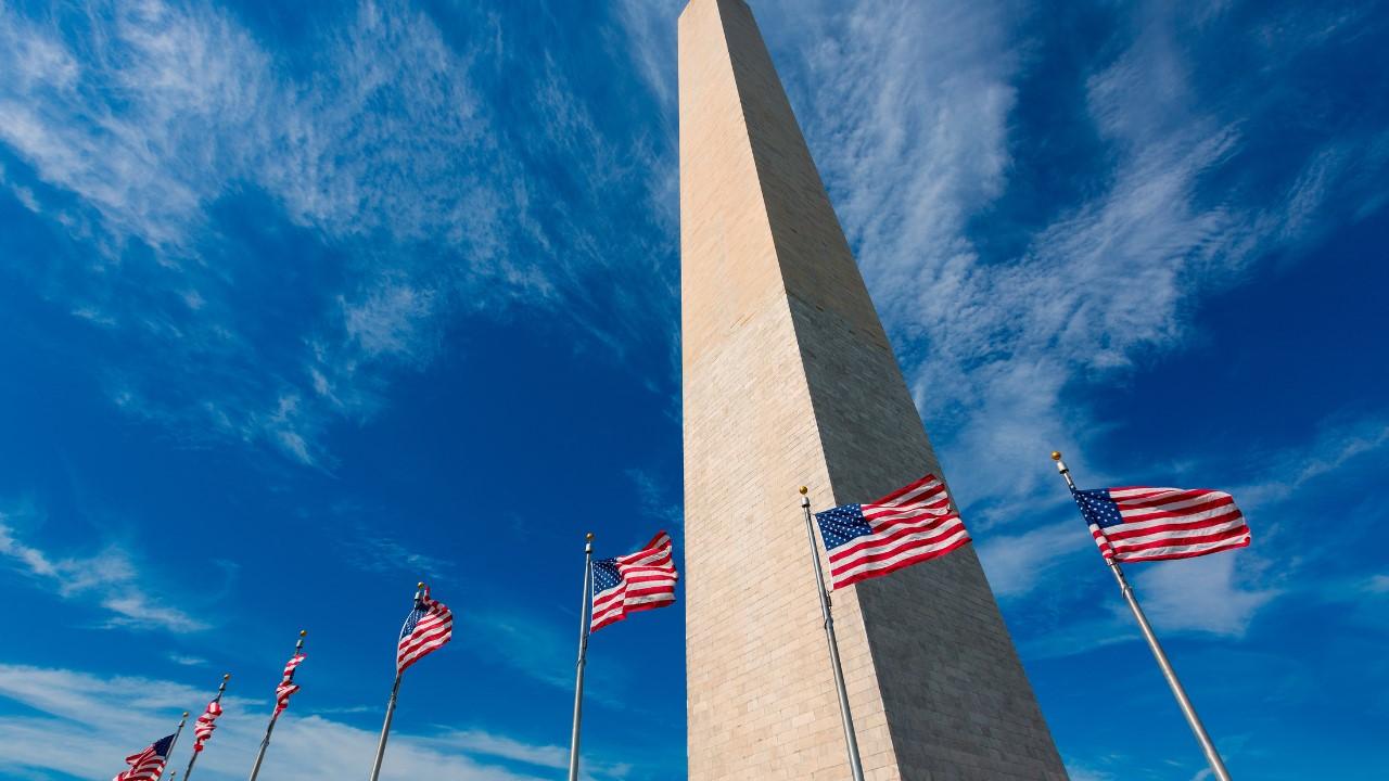 The American flag flying over the Washington Monument