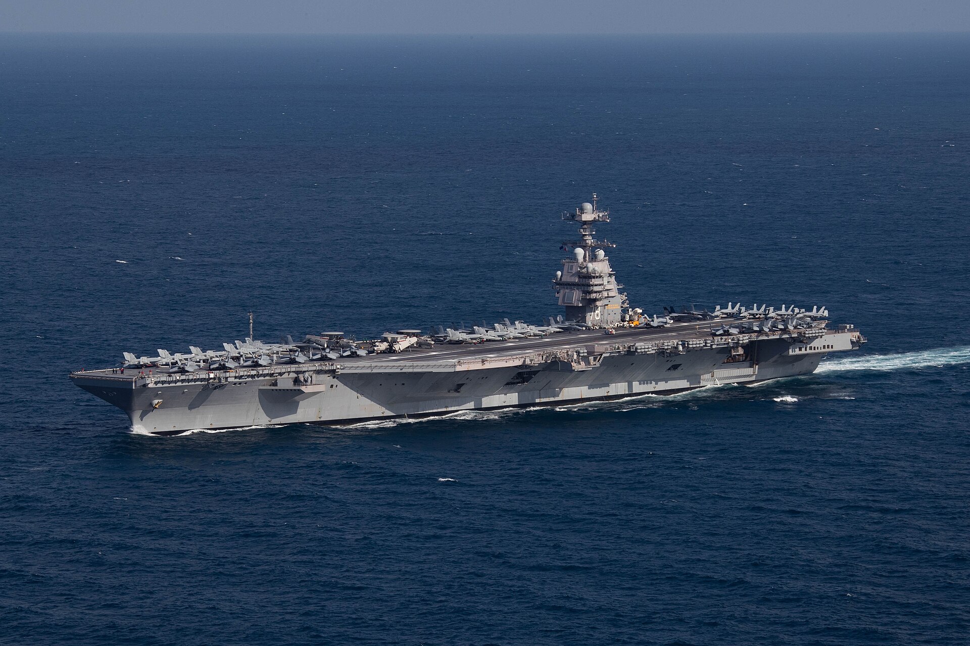 A US aircraft carrier at sea - a third carrier has been sent to the Middle East as Iran strike options are weighed