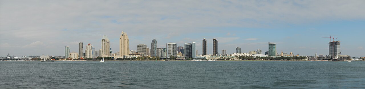 San Diego skyline in daylight across the bay — home to Naval Base San Diego, the Pacific Fleet's principal homeport