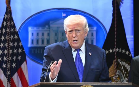 President Donald Trump speaking at a podium