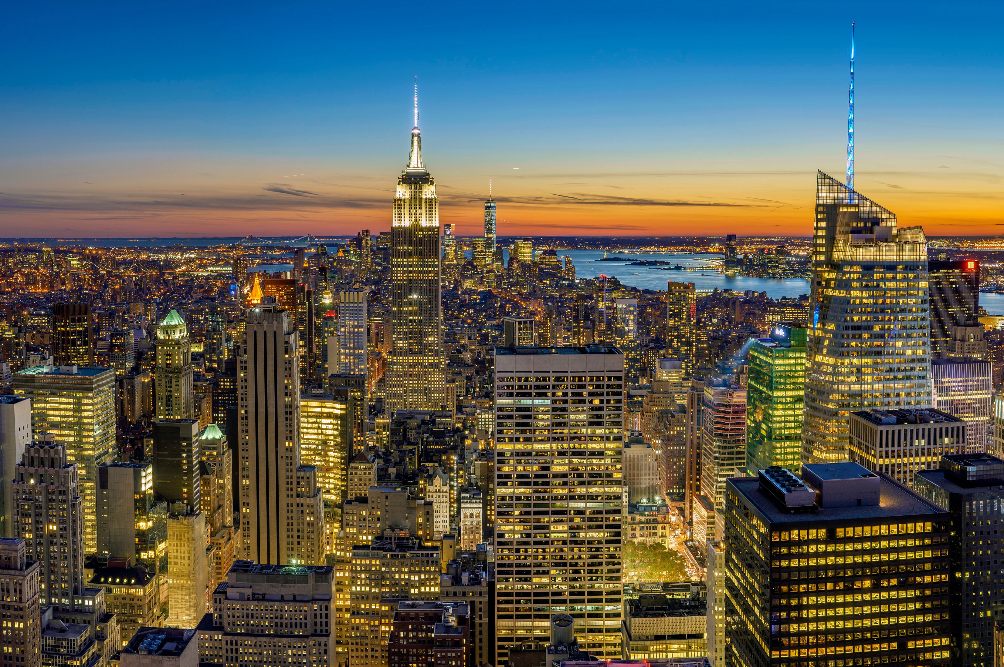 The Manhattan skyline at dusk, with the Empire State Building lit up — the new home of Tulsa King's fifth season