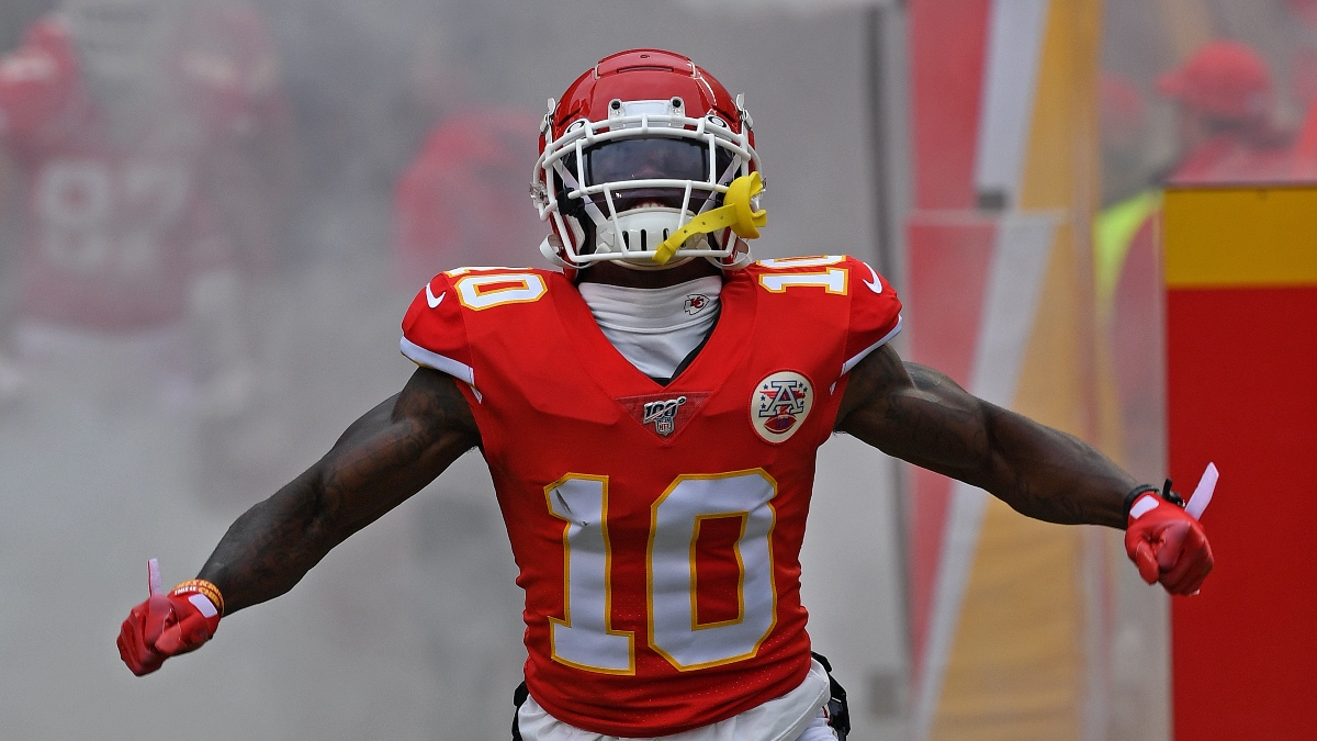 Tyreek Hill (10) in the Kansas City Chiefs red home uniform, catching a pass — Hill could be headed back to Kansas City as his agent opens negotiations Monday.