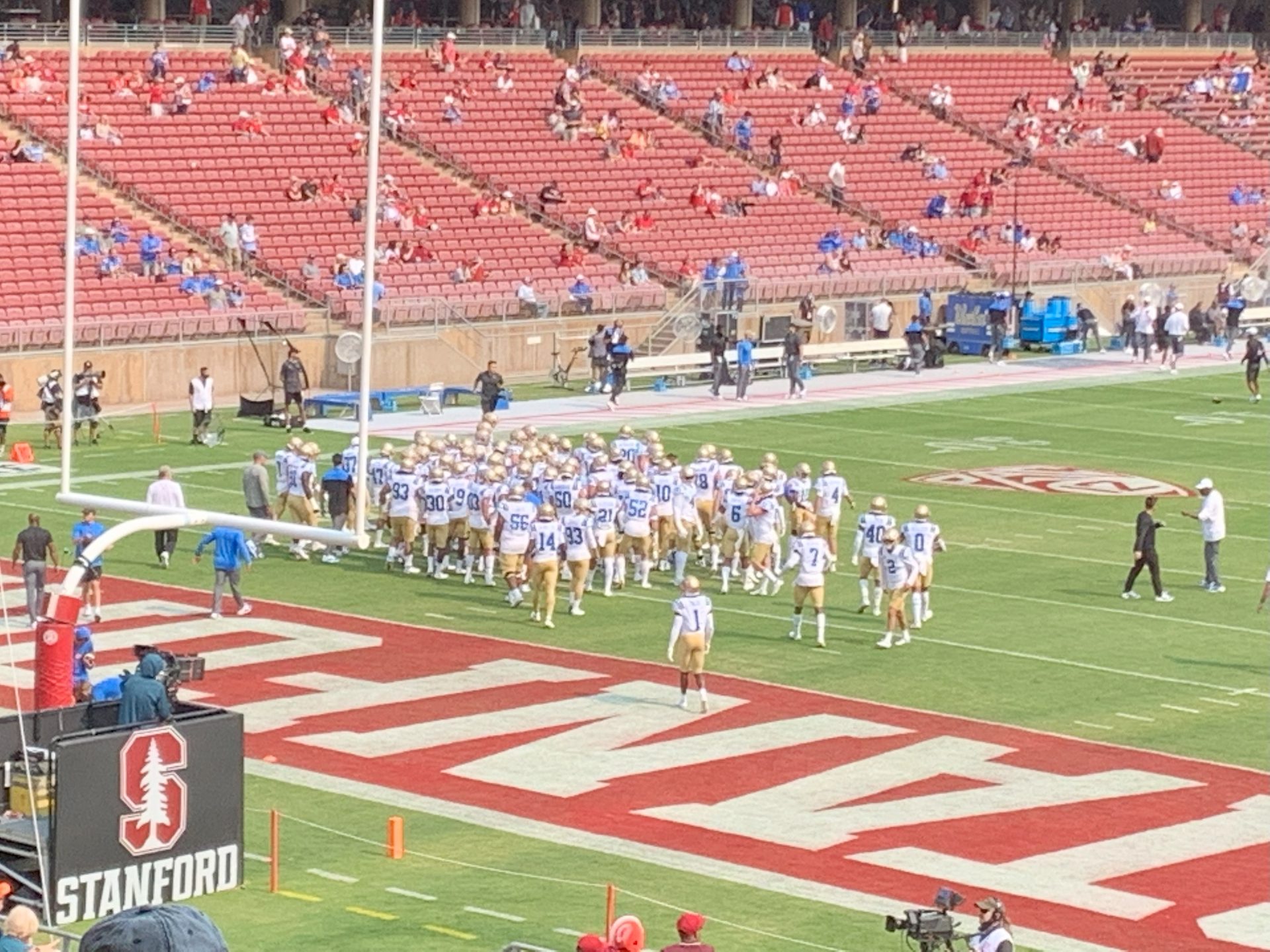 The UCLA Bruins football team in a huddle before a game (file photo)