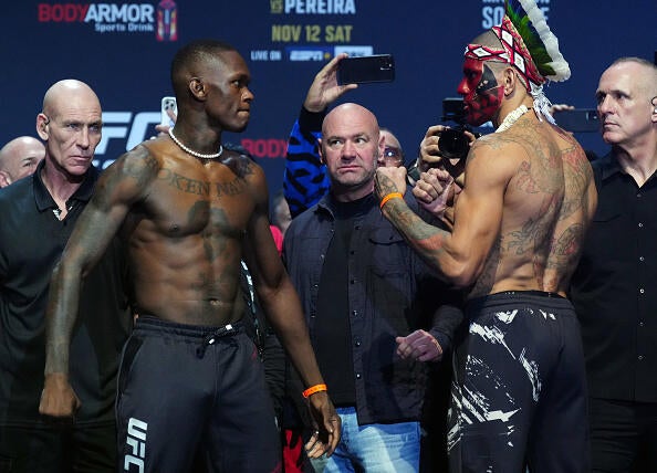 Alex Pereira faces off with Israel Adesanya at a UFC weigh-in — file photo